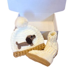 Handmade dog themed baby gift set with sausage dog hat and soft baby booties