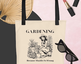 May include: A beige tote bag with black handles. The bag has a black and white illustration of a woman gardening with the text "GARDENING Because Murder Is Wrong".