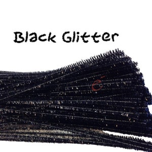 May include: A bundle of black pipe cleaners with glitter embedded in the plastic. The pipe cleaners are bundled together and have a frayed edge. The text "Black Glitter" is written above the pipe cleaners.