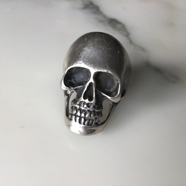 A wonderful vintage classic heavy sterling silver skull biker’s ring.