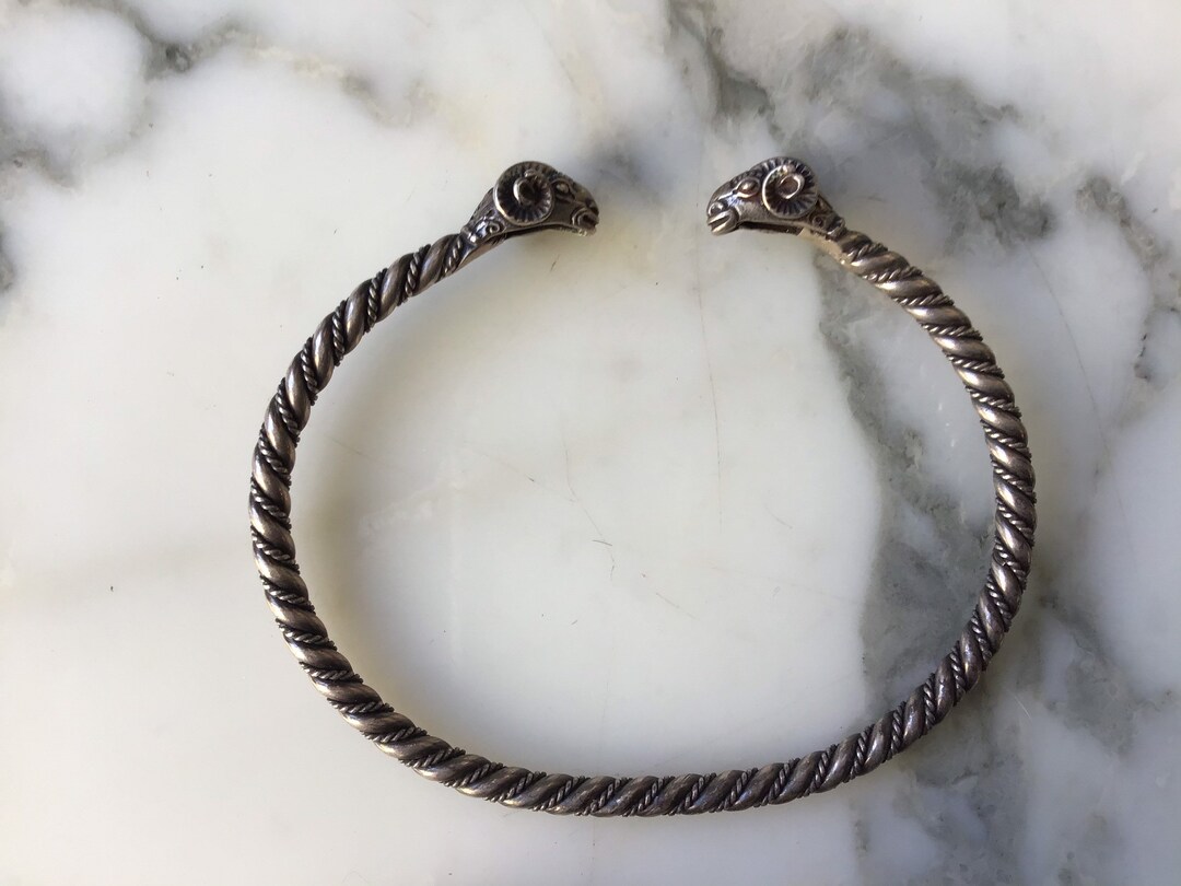 A classic vintage sterling silver ram’s head torque bracelet.