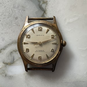 An elegant vintage Hermes 1950s gold plated manual wind gentleman’s wristwatch.