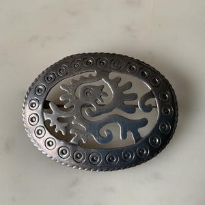 An interesting vintage Mexican Taxco signed sterling silver brooch.