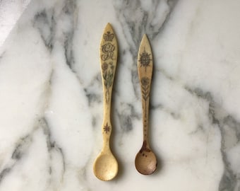 A couple of interesting 19th century inscribed lamb bone salt spoons.