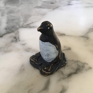 A delightful early 20th century cold painted bronze penguin.