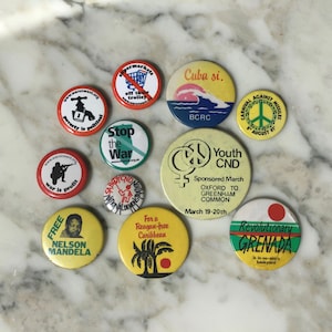 A cool set of early 1980s cause themed pin badges.