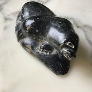 A lovely vintage Inuit stone carving of a seal.