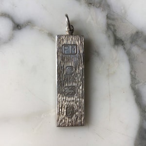 A very nice vintage sterling silver hallmarked ingot pendant.