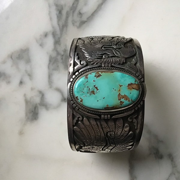 An exceptional sterling silver and turquoise Navajo Freddy Charley bracelet.