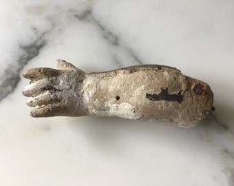 A rare and interesting 17th century carved pine and gesso statue arm.