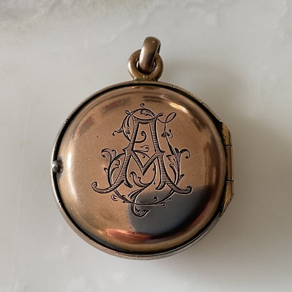 An unusual Victorian 9 carat gold and sterling silver compass locket fob or pendant.