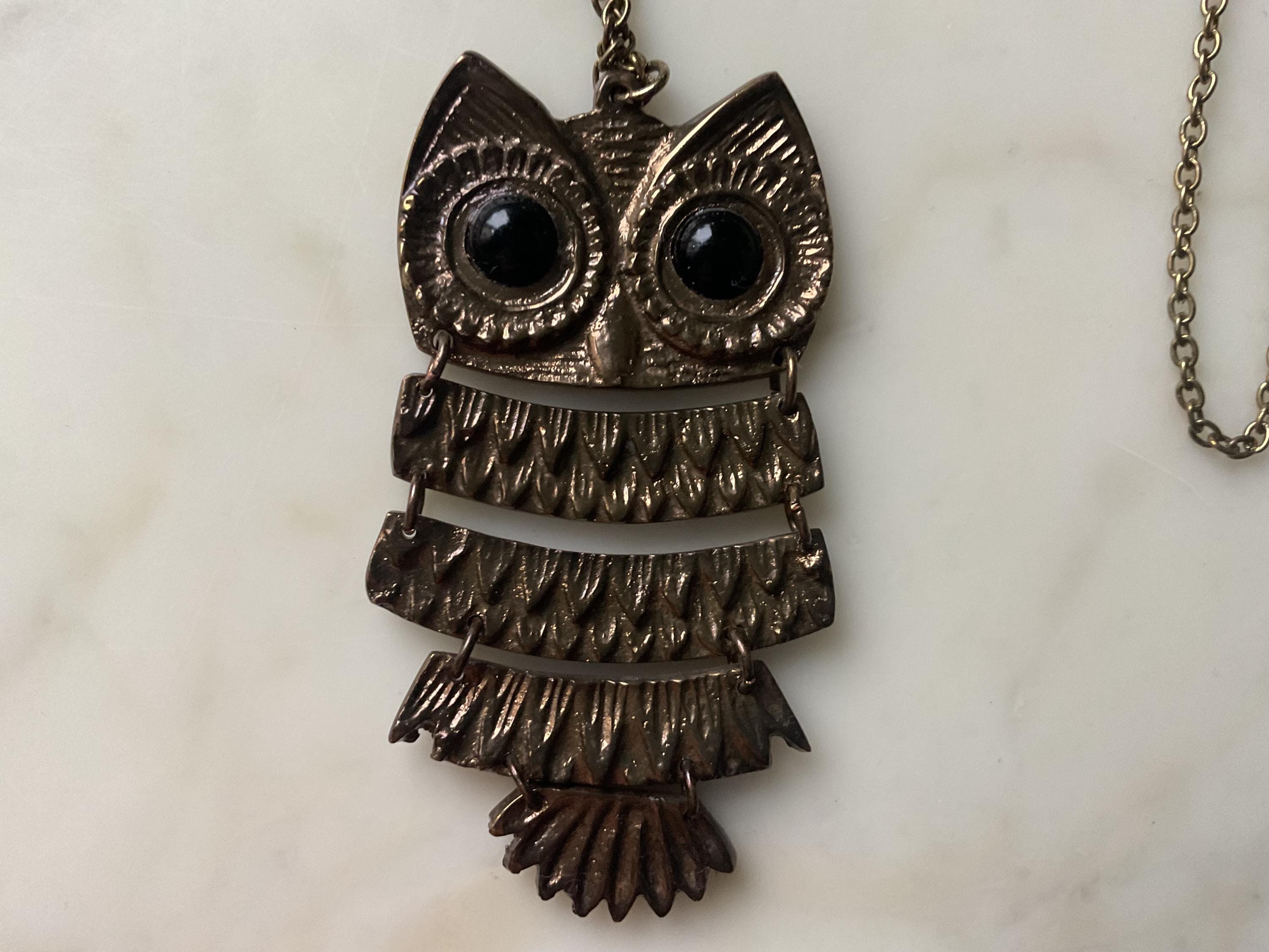 A large and striking vintage bronze articulated owl pendant and chain.