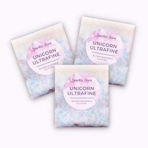 May include: Three small bags of biodegradable glitter labeled "Sparkle Town Unicorn Ultrafine Biodegradable Glitter". The bags are on a white background.