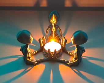 Portavelas de té con forma de fogata alienígena