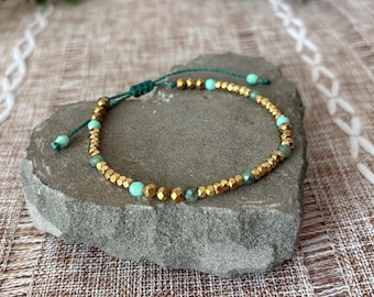 Handmade adjustable woven slip knot bracelet, gold tone beads, faceted glass sea foam green and white beads, Brazilian cord, 6-7in wrist