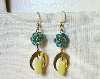 Handmade earrings with flower pieces and yellow/green rectangular gemstones