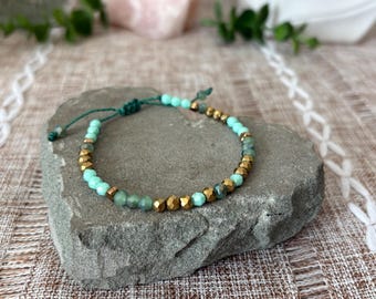 Handmade adjustable woven slip knot bracelet, gold tone beads, faceted glass sea foam green and white beads, Brazilian cord, 6-7in wrist