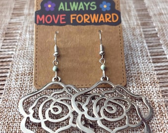 Handmade earrings with small faceted gemstones and silver toned flower pieces