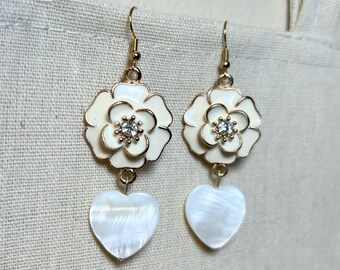 Handmade earrings with shell heart pieces and flower charms