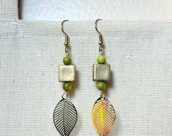 Handmade earrings with leaf charms and green gemstones