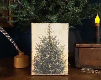 May include: A vintage-style illustration of a green Christmas tree on a cream-colored background. The image is printed on a wooden block.