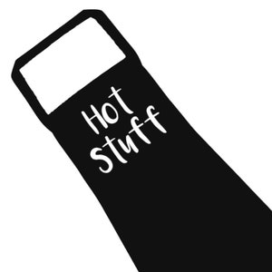 May include: Black apron featuring the white text "Hot Stuff". The apron has a rectangular top section and a long, rectangular body. The text is written in a cursive style.