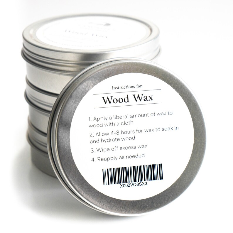 May include: A silver tin with a white label that reads "Instructions for Wood Wax" and lists instructions for applying the wax. The label also includes a barcode and the text "X002VQ8SX3".