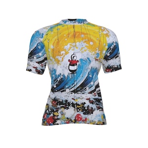 May include: A short-sleeved, form-fitting shirt with a colorful, cartoonish design. The shirt features a penguin in a red and white outfit riding a wave, with a yellow and blue background. The design covers the entire shirt.