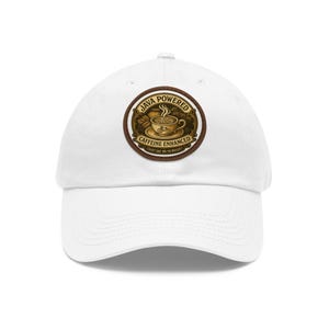 May include: White baseball cap with a circular patch featuring a coffee cup, bicycle, and the words "Java Powered Caffeine Enhanced". The patch has a brown border and the text "Just Say No To Decaf".