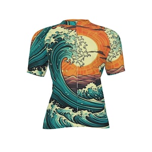 May include: Short-sleeved shirt with a Japanese wave design in teal, orange, and purple. The artwork shows a large wave and a setting sun. The shirt has a high collar and is made of a lightweight material.