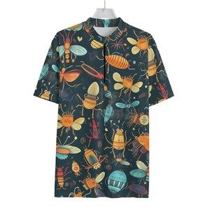 May include: Short-sleeved shirt with a dark teal background and a colourful insect pattern. The insects are in shades of orange, yellow, blue, and teal. The shirt has a mandarin collar and a black zip.