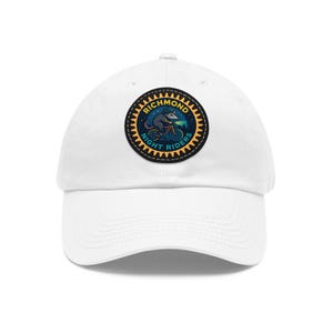 May include: White baseball cap with a circular patch. The patch features the text "Richmond Night Riders" and an illustration of a possum cycling under a starry night. The patch has a yellow, jagged border.
