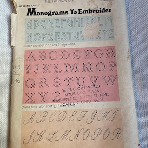 May include: A vintage Butterick pattern envelope featuring monograms to embroider. The envelope displays block, cross-stitch, and script alphabets in various sizes. The text includes the pattern number, price, and store information.