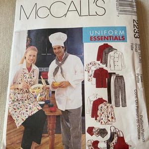 May include: McCall's sewing pattern for Uniform Essentials. The package features a photo of a chef and a woman wearing an apron. The pattern includes options for chef coats, aprons, pants, and hats. The size is small (34-36).