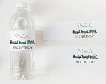 Puede incluir: Tres etiquetas blancas con un diseño de tren y el texto "Michael's 3rd Birthday".