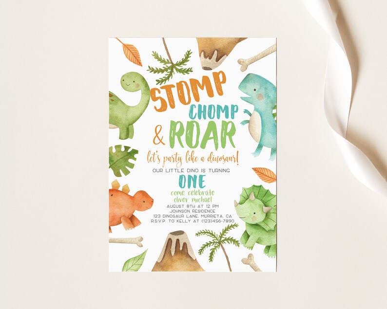 May include: A colorful dinosaur-themed birthday party invitation with a green, orange, and blue dinosaur illustration. The text reads "STOMP CHOMP & ROAR let's party like a dinosaur! Our little dino is turning ONE come celebrate Oliver Michael August 8th at 12 PM Johnson Residence 123 Dinosaur Lane Murrieta CA RSVP to Kelly at (123) 456-7890"