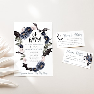 May include: A baby shower invitation with a gothic theme. The invitation features a black coffin with bats and flowers. The text on the invitation reads "Oh Baby!" and includes the name "Miranda Jones".