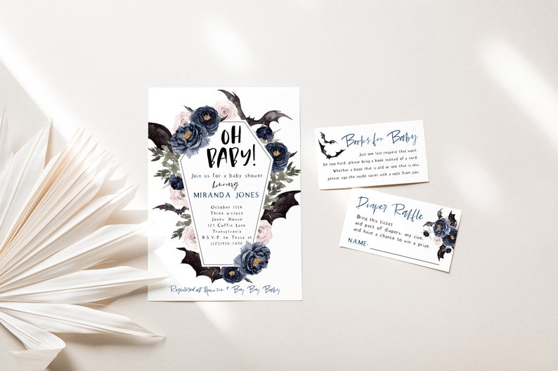 May include: A baby shower invitation with a gothic theme. The invitation features a black coffin with bats and flowers. The text on the invitation reads "Oh Baby!" and includes the name "Miranda Jones".