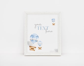May include: A white framed print with a watercolour illustration of three blue and white hot air balloons. The text "your text here" is written in cursive on the print.