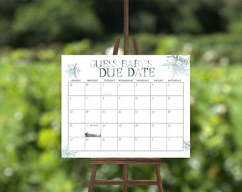 May include: A white calendar with a blue snowflake design. The calendar is titled "Guess Baby's Due Date" and has the months of September and October listed. The date of October 22nd is marked with a small mountain graphic.