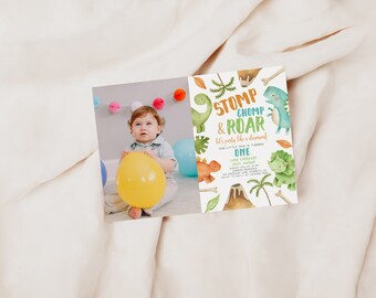 May include: A dinosaur-themed birthday invitation with a green, orange, and blue colour scheme. The invitation features a cartoon dinosaur with the text "Stomp & Chomp & Roar! Let's party like a dinosaur! Our little dino is turning one!"