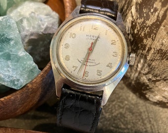 Vintage HERNA reloj para hombre 17 joyas Incabloc antimagnético irrompible 1960 corre