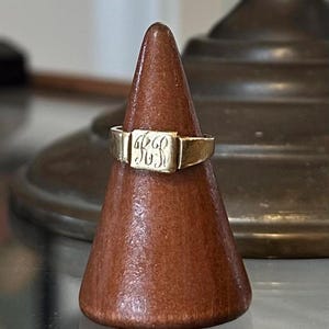 May include: A set of three ceramic mugs with a speckled, matte finish. The mugs are in shades of cream, light gray, and dark gray. Each mug has a simple, minimalist design, perfect for coffee or tea.