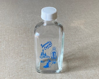 VINTAGE Souvenir de Lourdes Holy Water Clear Glass Bottle Blue Lettering White Cap - Small Amount of Water Still Inside - Mid Century