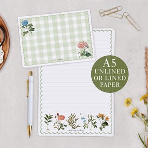 May include: A5 stationery set featuring a green gingham design and floral illustrations. The set includes lined and unlined paper, a pen, and paperclips. The text "A5 Unlined or Lined Paper" is displayed on a green circle.