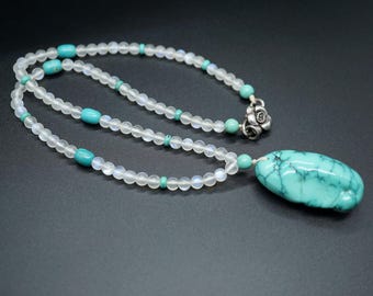 Natural Moonstone Necklace: Turquoise Charm, Silver Flower Clasp