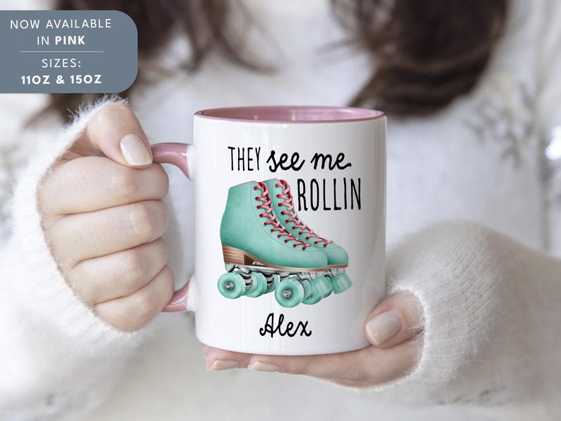 a woman holding a coffee mug with roller skates on it
