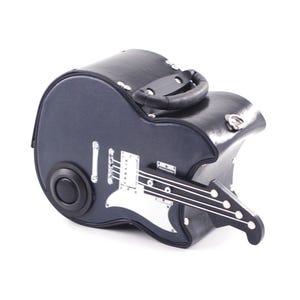 May include: Black leather guitar-shaped case with a silver guitar design and a handle on top.