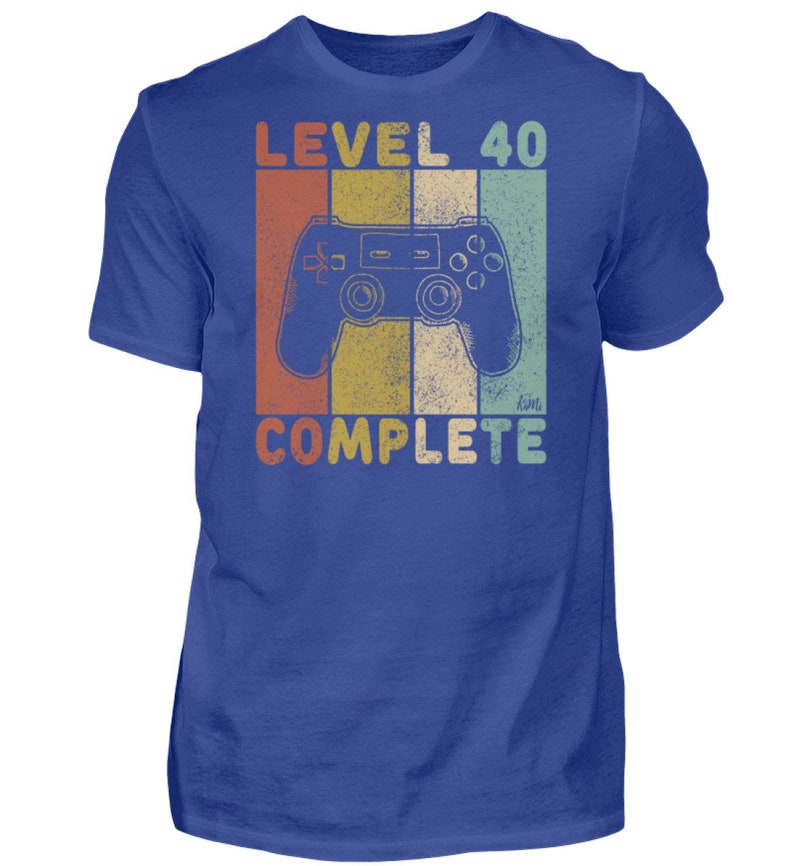 May include: A blue t-shirt with a retro-style graphic of a video game controller and the text "Level 40 Complete".