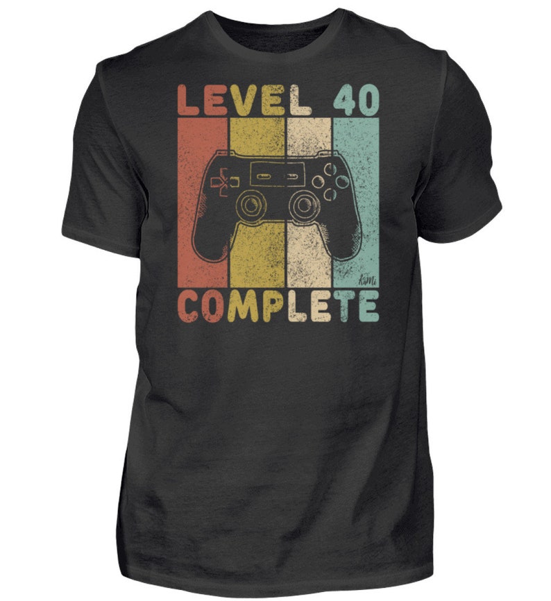 May include: A black t-shirt with a vintage-style graphic of a video game controller and the text "Level 40 Complete".